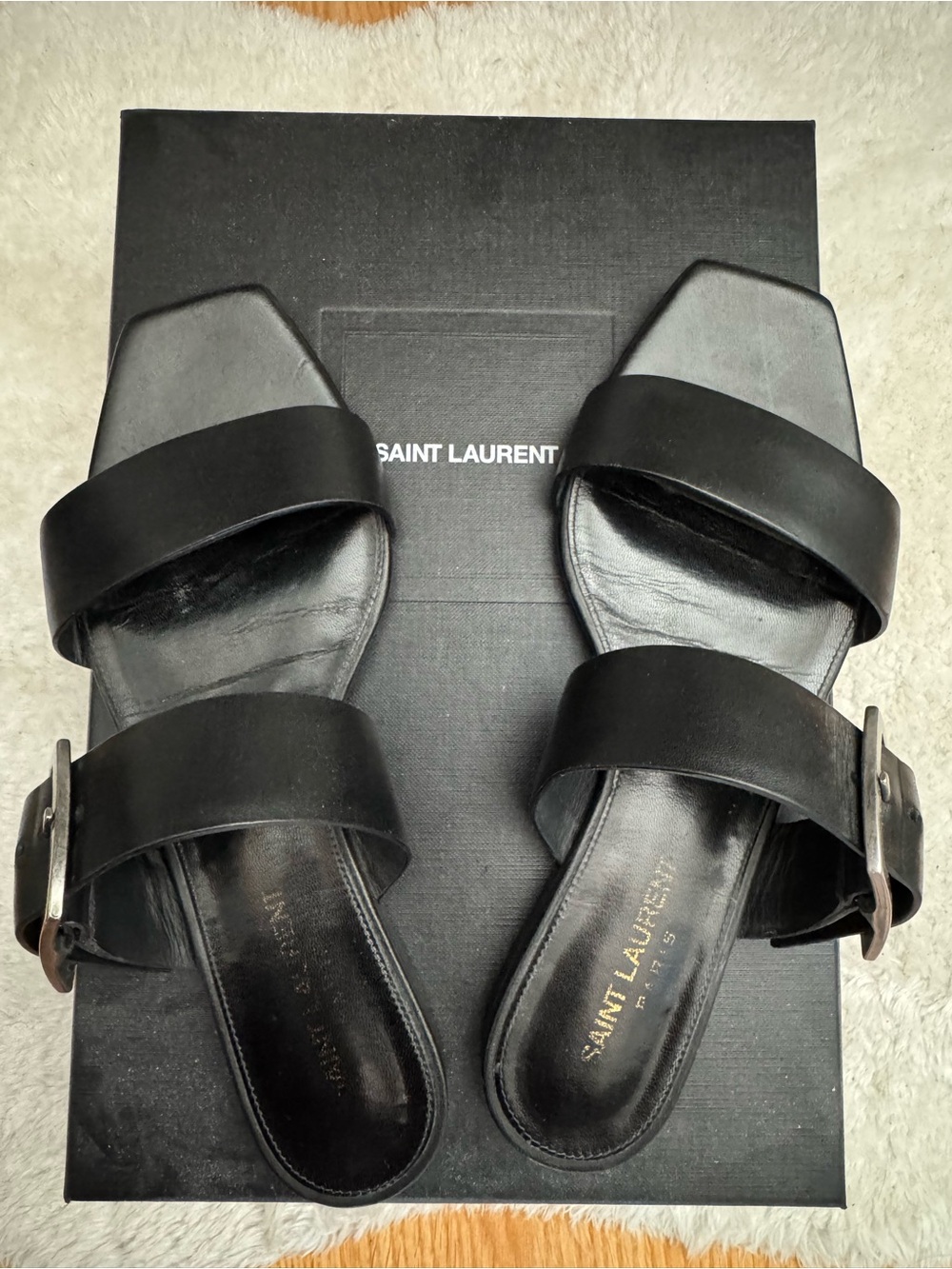 Saint Laurent Black Leather Double-Band Slide Sandals with Silver Buckles.